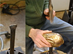 15. with the tool shown on the left side in the groove formed in the previous step, shaping the ear from the outside.