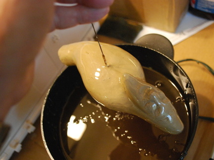2. The clay model has been dipped in hot liquid Dip Seal, which solidifies immediately upon being lifted out of the pot.