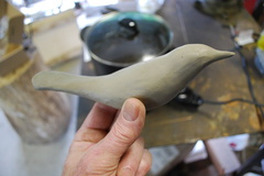 1. In order to determine the shape to cut out of sheet brass, the first step is a clay model.