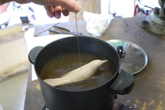 2. The clay model is submerged in "Dip Seal" which has been heated at 350° to a liquid state.