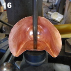 16. Using the hydraulic press to push out the nose.