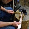 2. Starting the cylindrical form with hammer and wood V-block.
