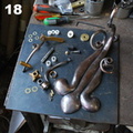 18. Here are most of the parts, prior to the fina assembly. I had not yet made the little troll for the chain. Including all the screws and washers, there are over 60 pieces. In this picture you can see the two brass sleeves, which were silver-soldered in