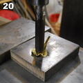 20. Pushing out a bulge on a polyurethane block with the hydraulic press.