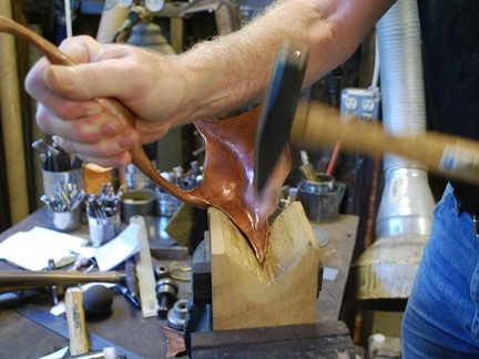 6. Forming the points of the top on a wood V-block.