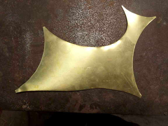 1. This is a scrap of 16 gauge brass, about 10" long, what was in between a few other rounded shapes that had been cut out for other projects. When I saw the shape it reminded me of a four-legged animal running.