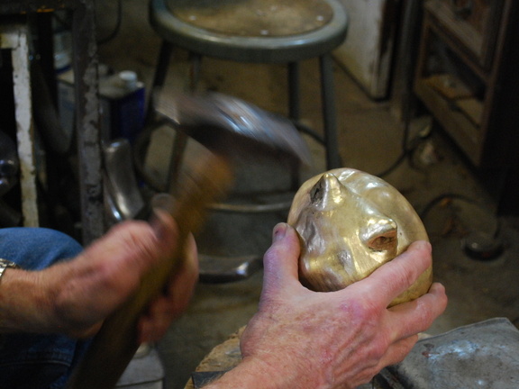 12. More hammering, on the front of the ears, using the same tool trhat was used with the press.