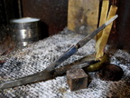 28. Straps of brass have been silver-soldered to the head, so it can be fastened invisibly to the interior of the wood.