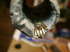 31. The hand secured with a screw.