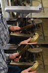 9. Using the special back part of the raising stake to achieve the ninety degree bend that forms the flange at the bottom.