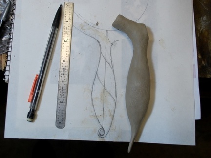 1. Starting with a sketch and a clay model of the handle.